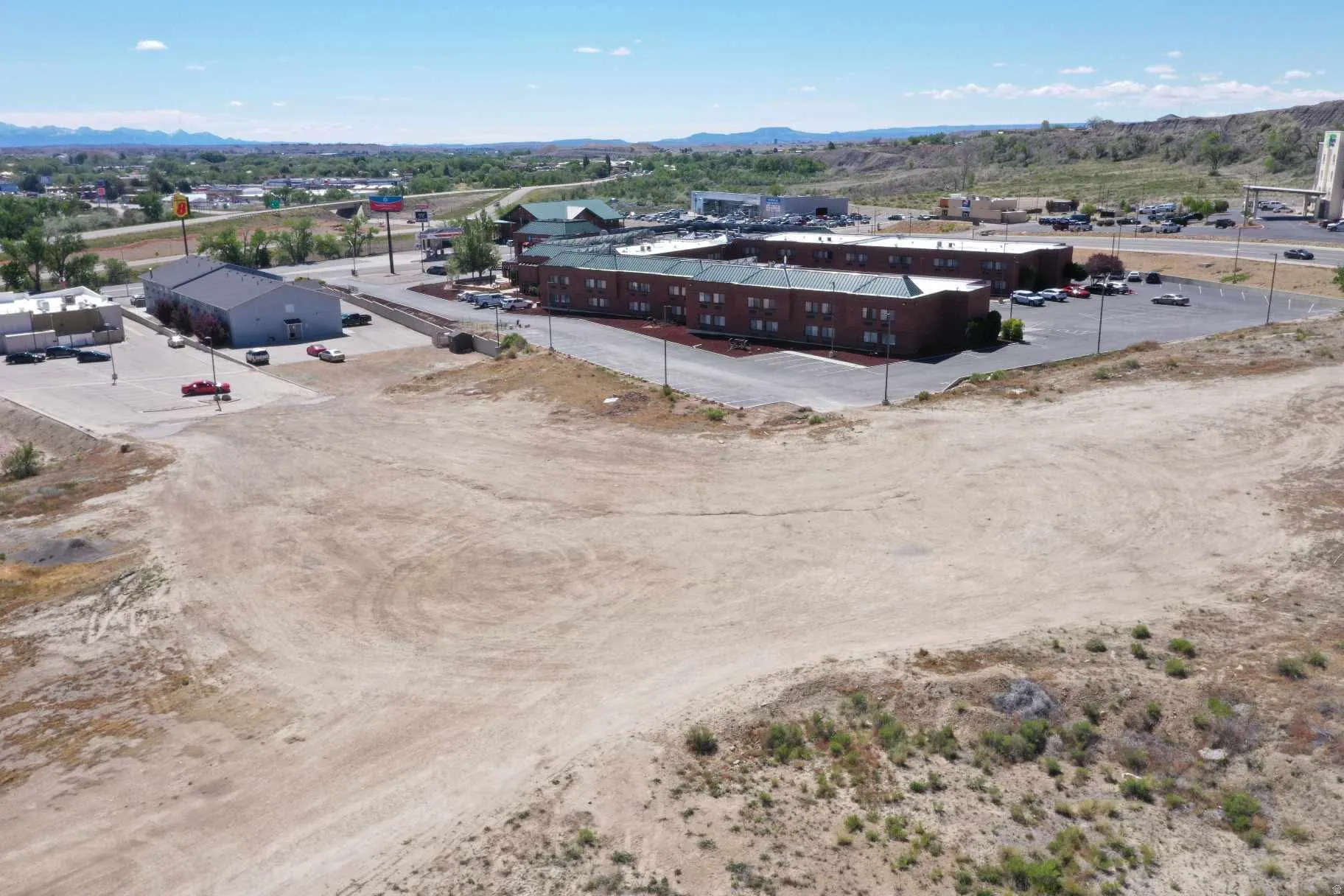 Expansive vacant land parcel featuring a level, cleared surface