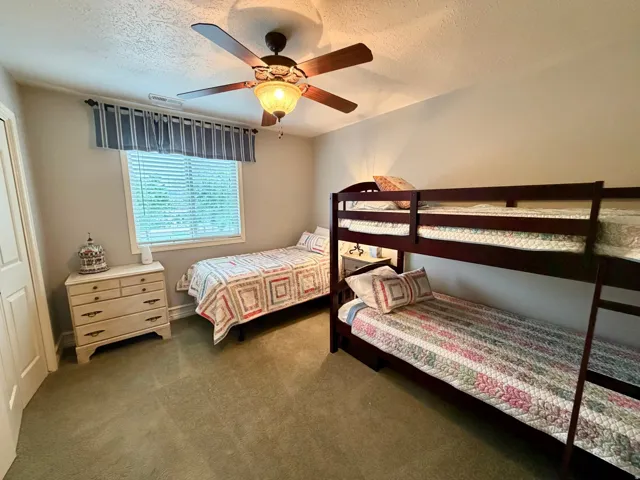 Bedroom featuring light-colored walls and carpet flooring