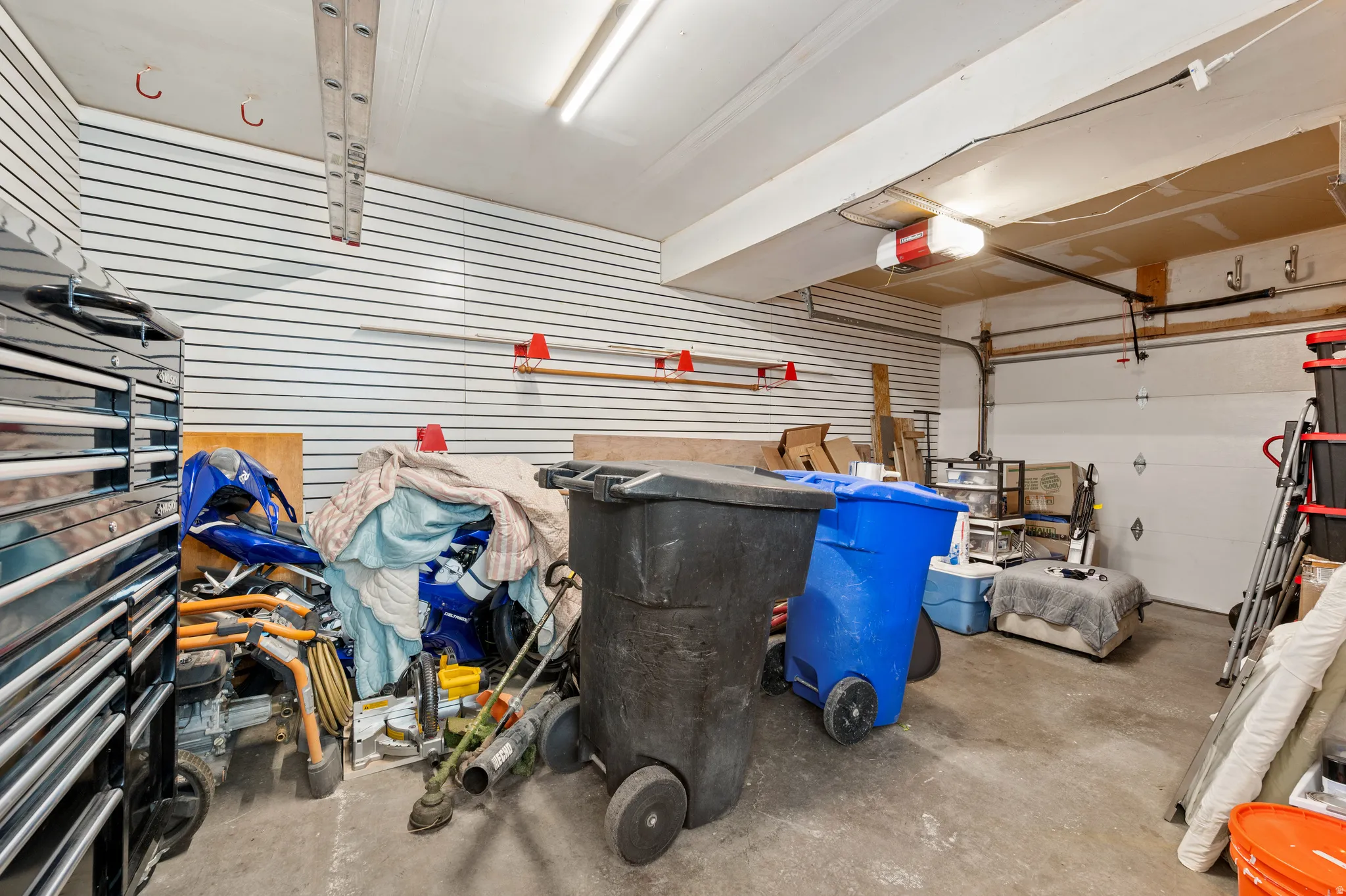 Featuring slat walls, and a workbench.