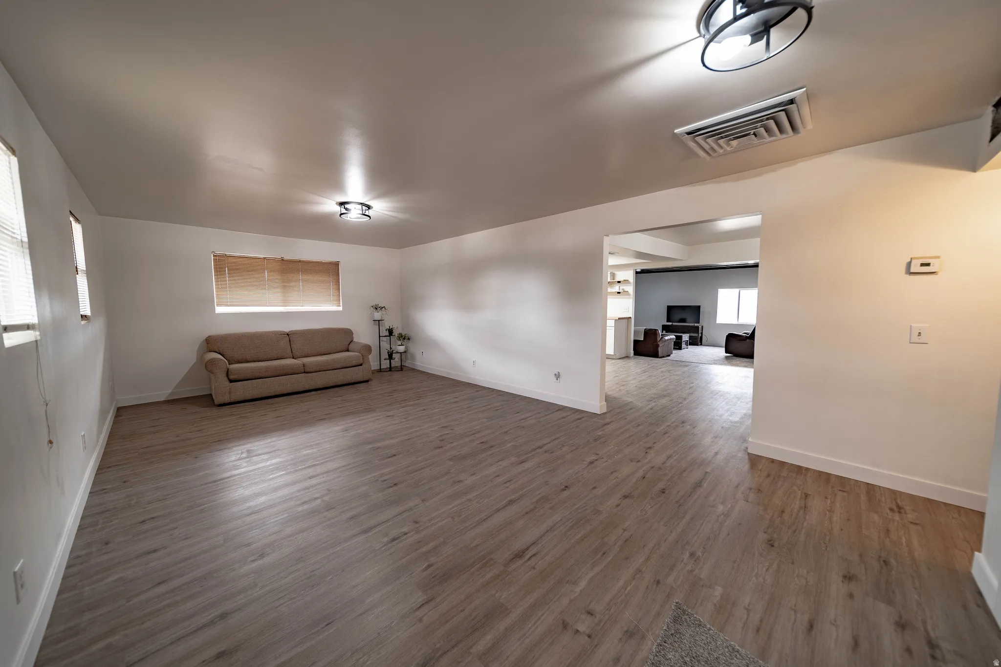 Spacious interior featuring wood-finish flooring throughout