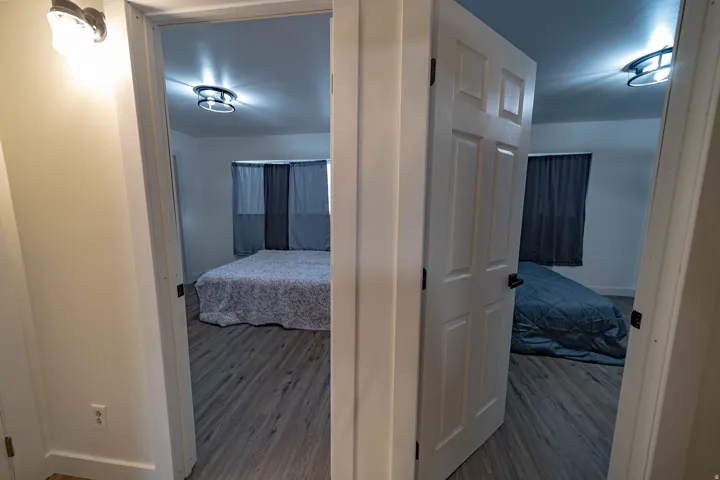 Rooms featuring wood-finish flooring, neutral wall tones, and modern flush-mount lighting fixtures