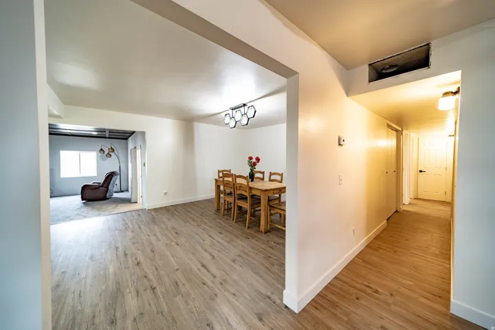 Open-concept floor plan featuring wood-finish flooring throughout