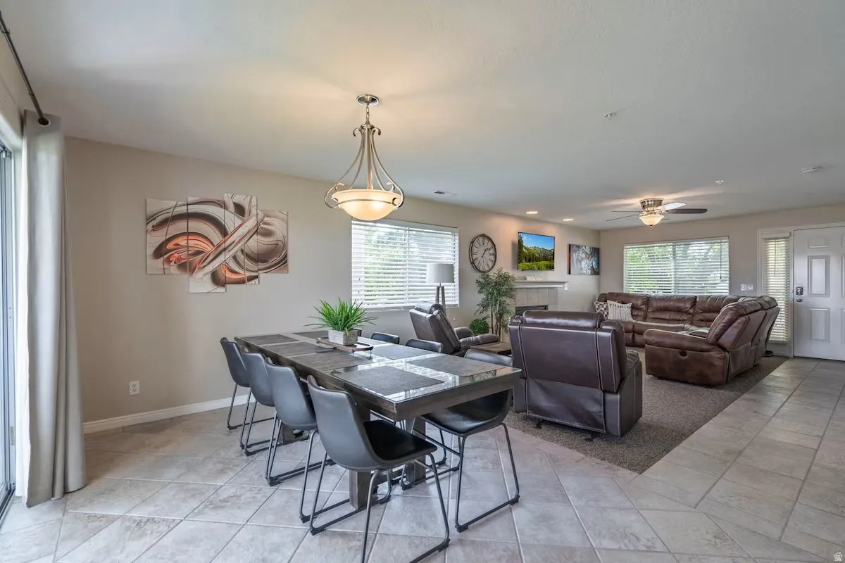 Open-concept living space featuring a dining area with tile flooring and a formal entry