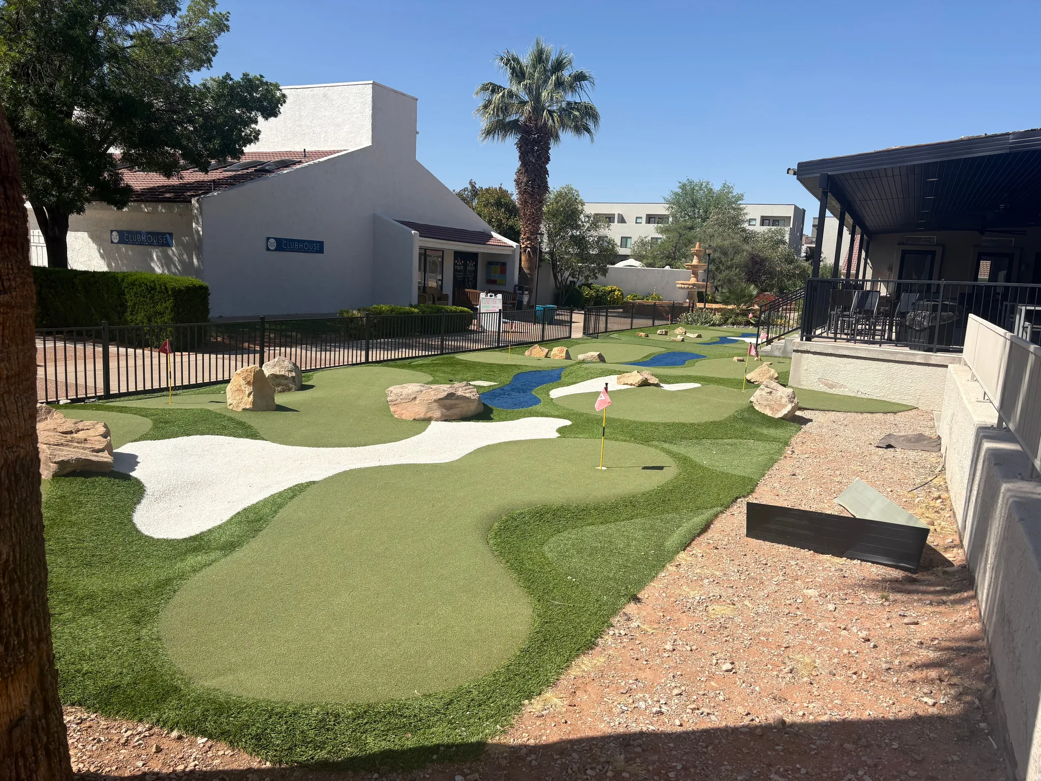 Miniature golf course featuring multiple greens and sand traps
