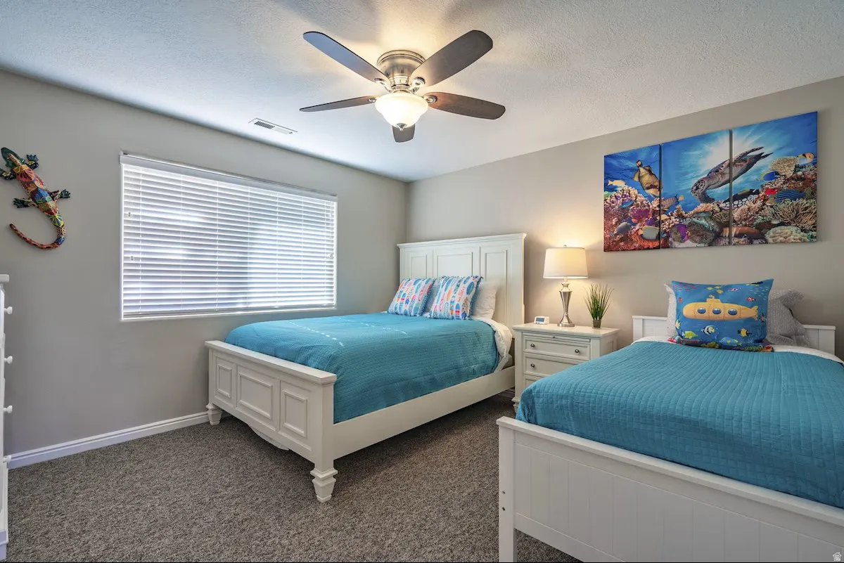 Room featuring neutral-toned walls and gray carpeting