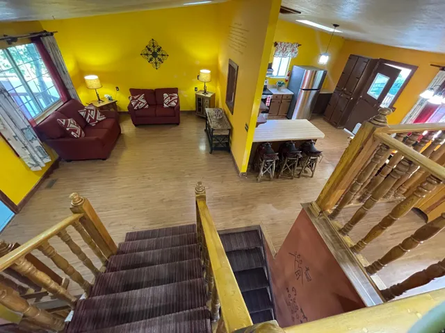 Open-concept main living area with wood-finish flooring