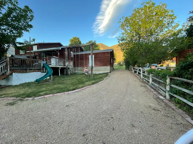 Gravel driveway with split rail fencing