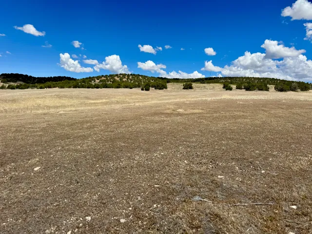 Expansive open terrain featuring natural vegetation and distant rolling hills, 19.5 acres north of Fillmore, UT