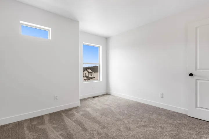 Neutral-toned carpeting paired with white walls