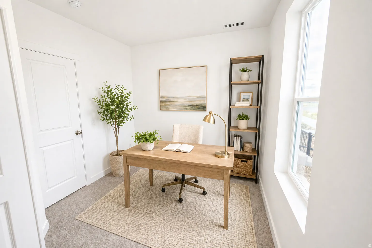 Bright room featuring a large window, light-toned carpeting, and a white paneled door