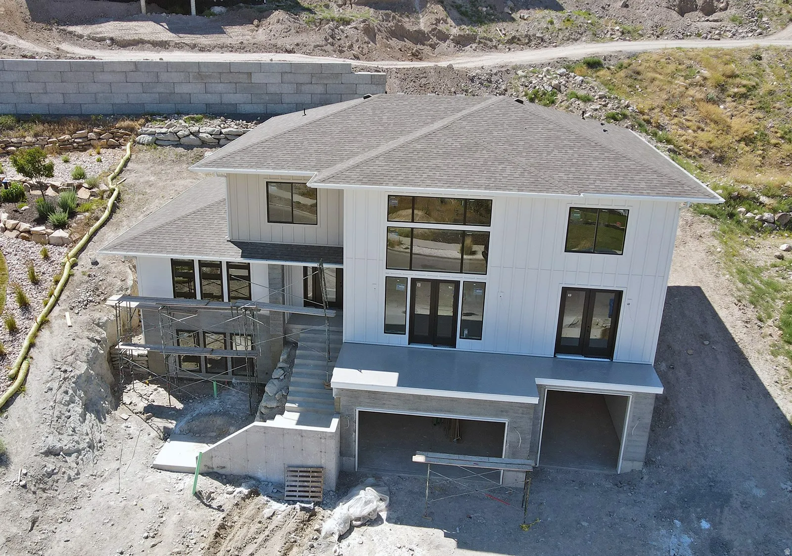 Modern multi-story residence featuring white board-and-batten siding