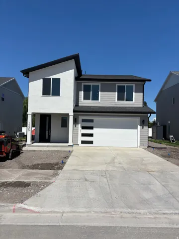 Contemporary two-story exterior featuring a partial stucco finish and horizontal siding
