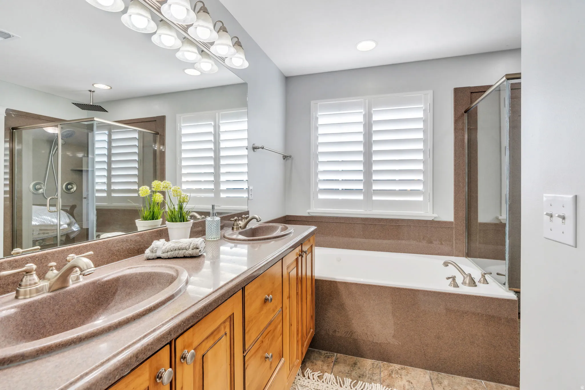 En suite bathroom with double vanity, and jetted tub
