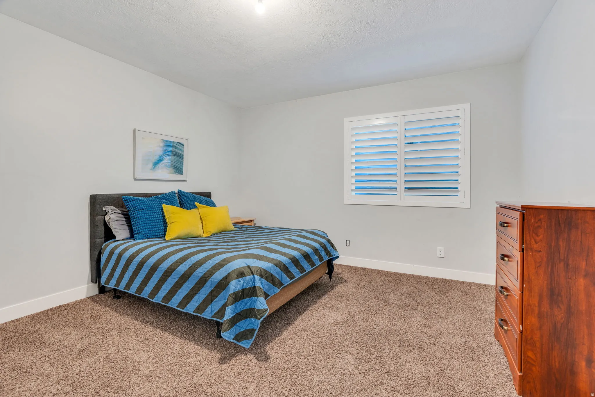 Basement carpeted bedroom