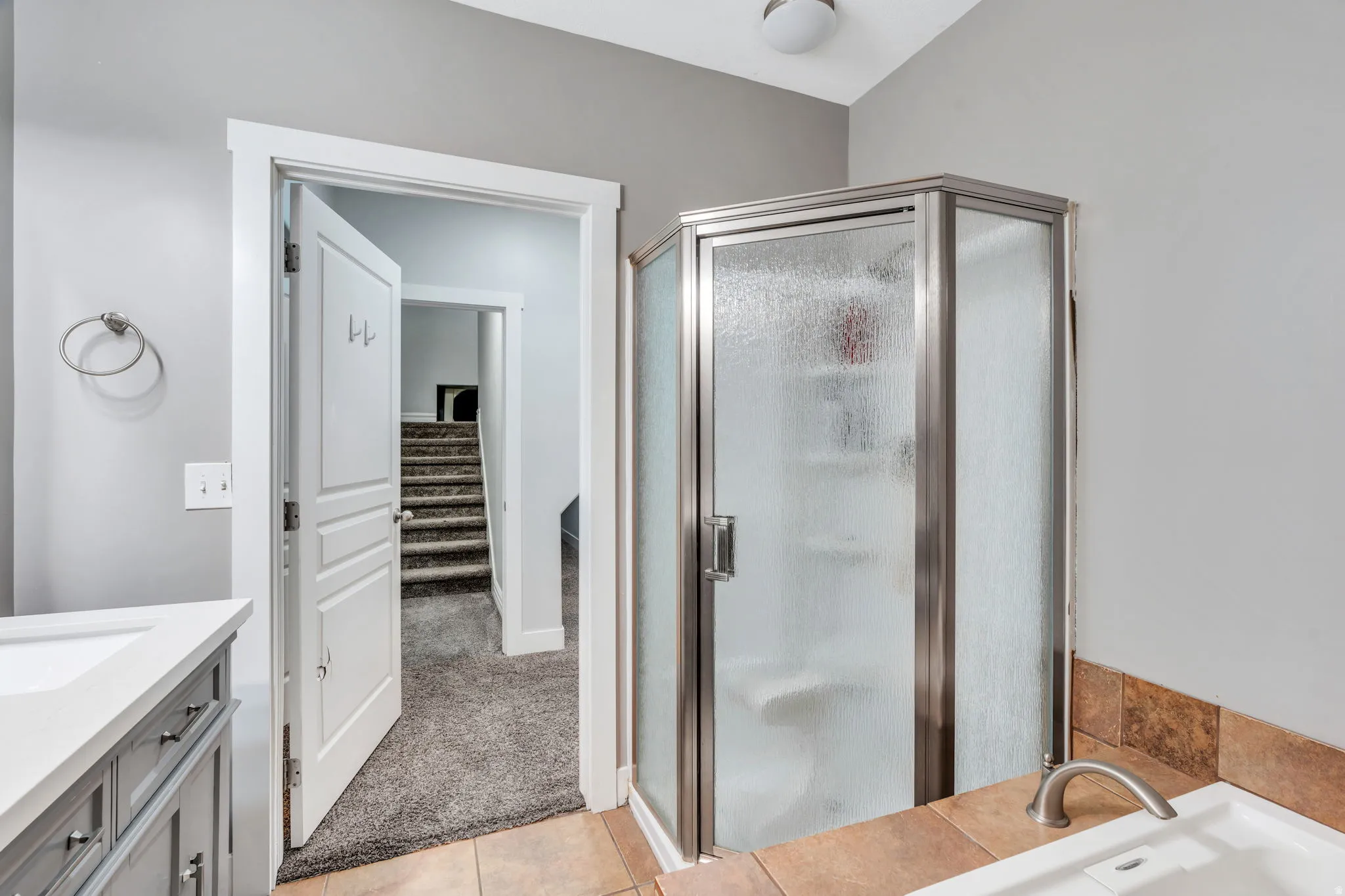 Full bath featuring shower stall