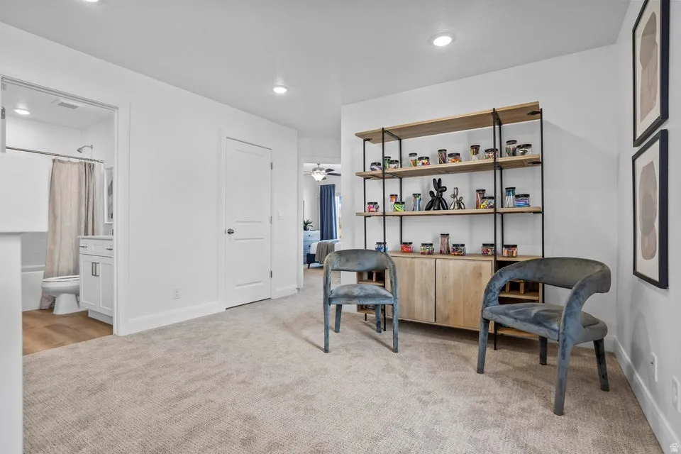 Open interior space featuring recessed lighting and neutral carpeting