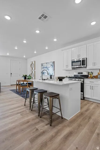Open-concept living area with wood-finish flooring