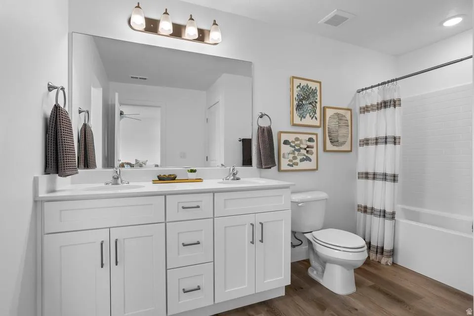 Dual-sink vanity with white cabinetry and integrated sinks