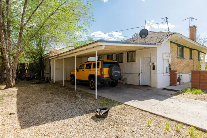 Carport structure providing sheltered parking