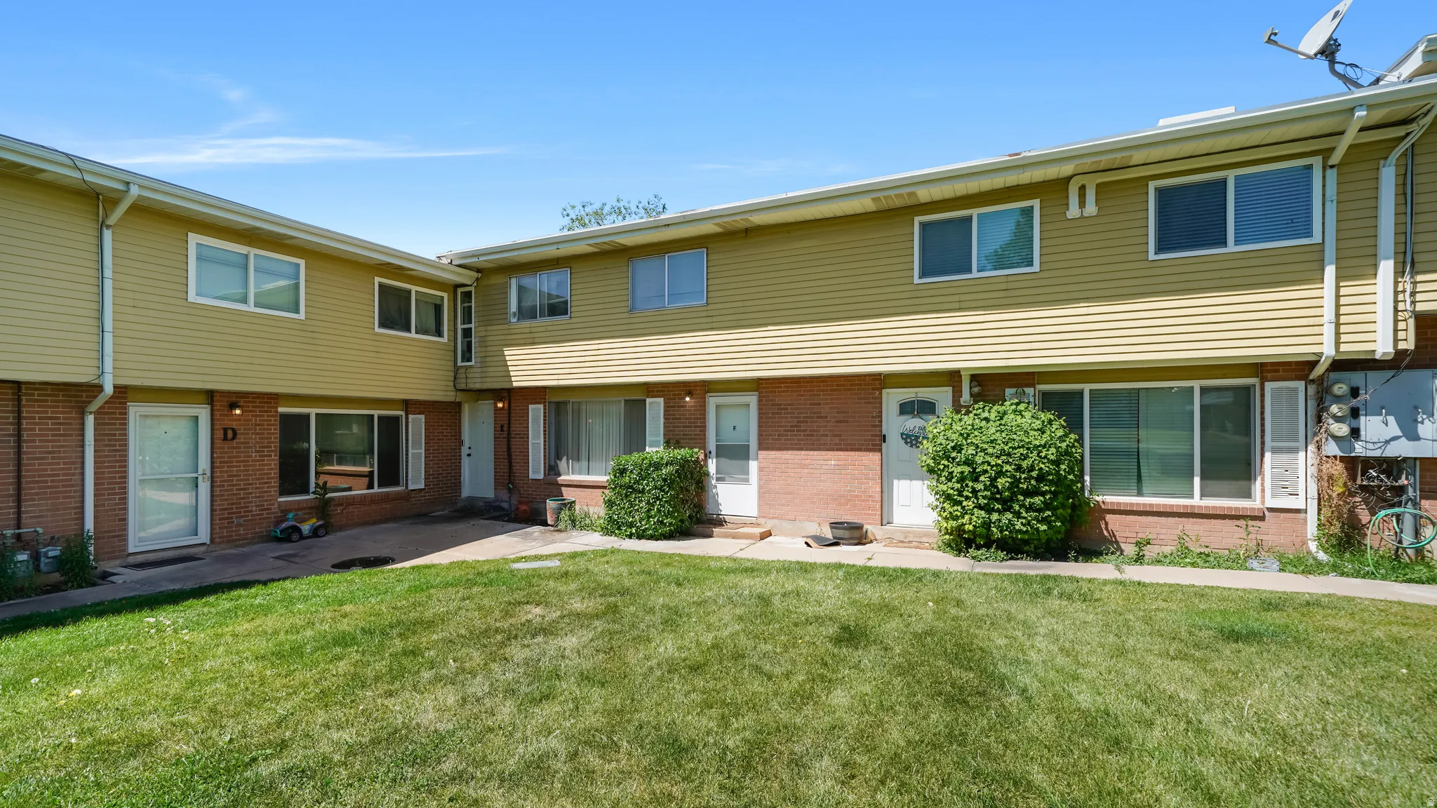 Multi-unit residential structure featuring a combination of brick and horizontal siding
