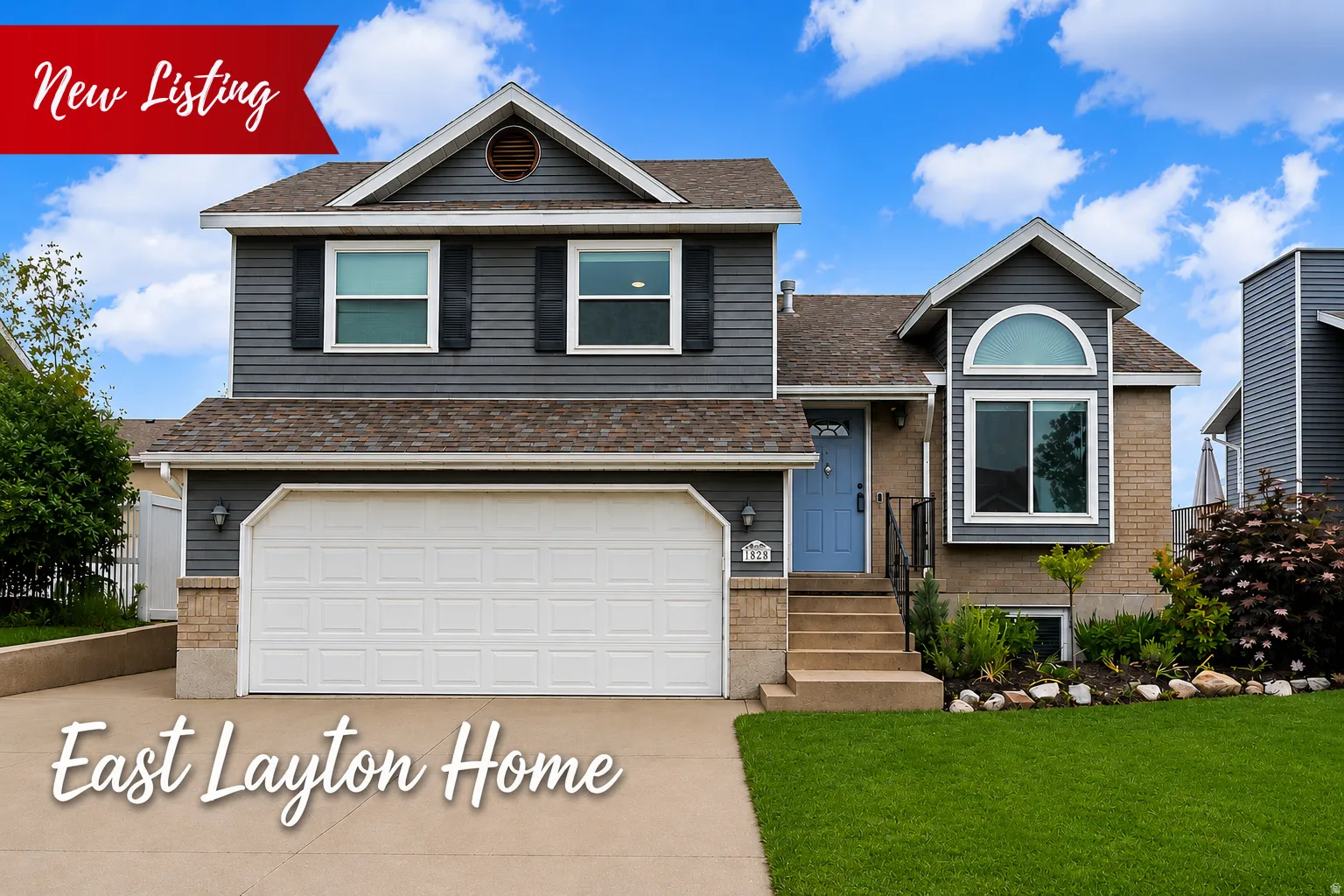 Two-story residence featuring a two-car garage, brick and siding exterior, blue entry door, arched window detail, and a landscaped front yard with a concrete driveway.