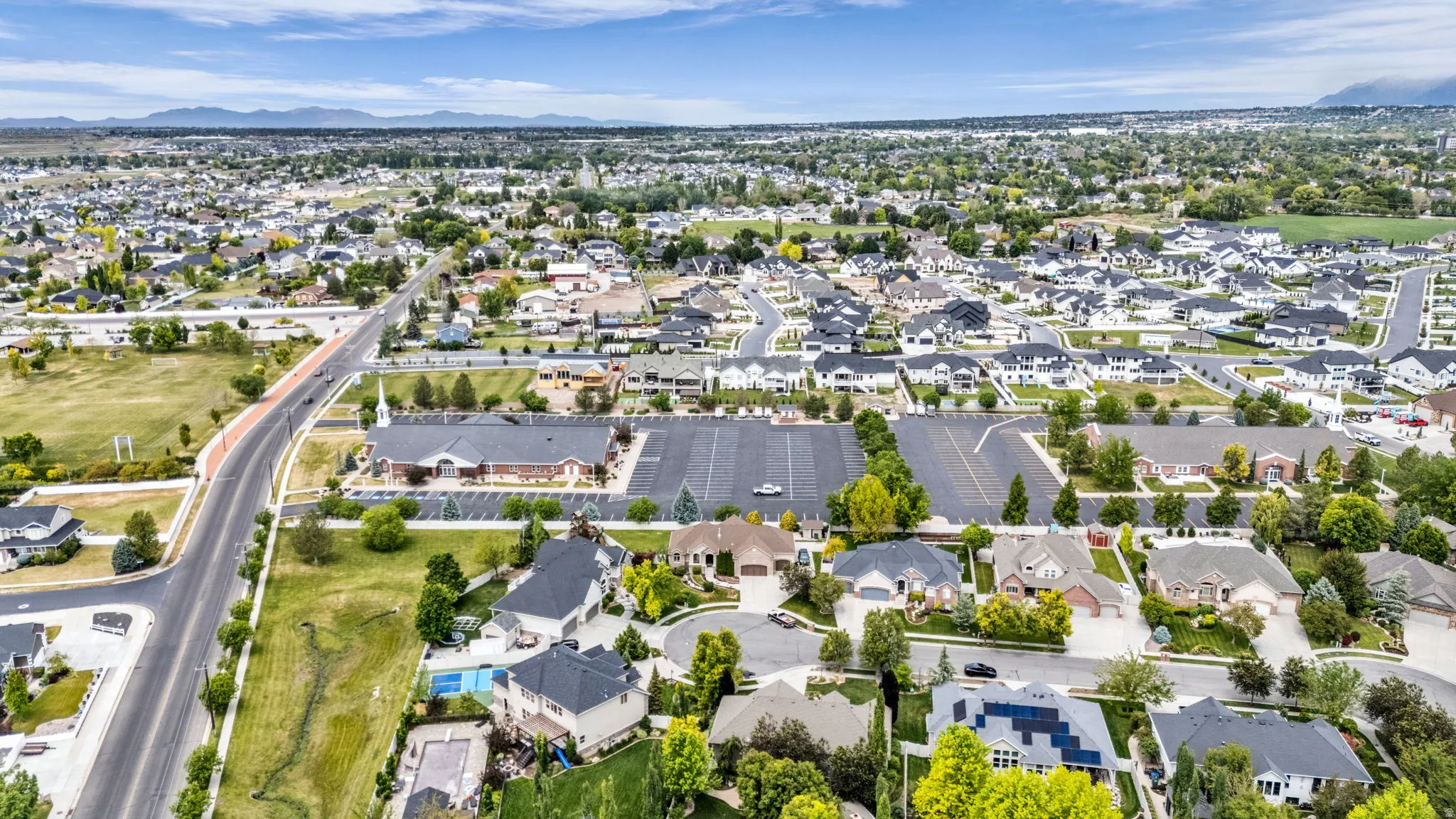 Aerial perspective of an established residential area with mature trees and varied architectural styles