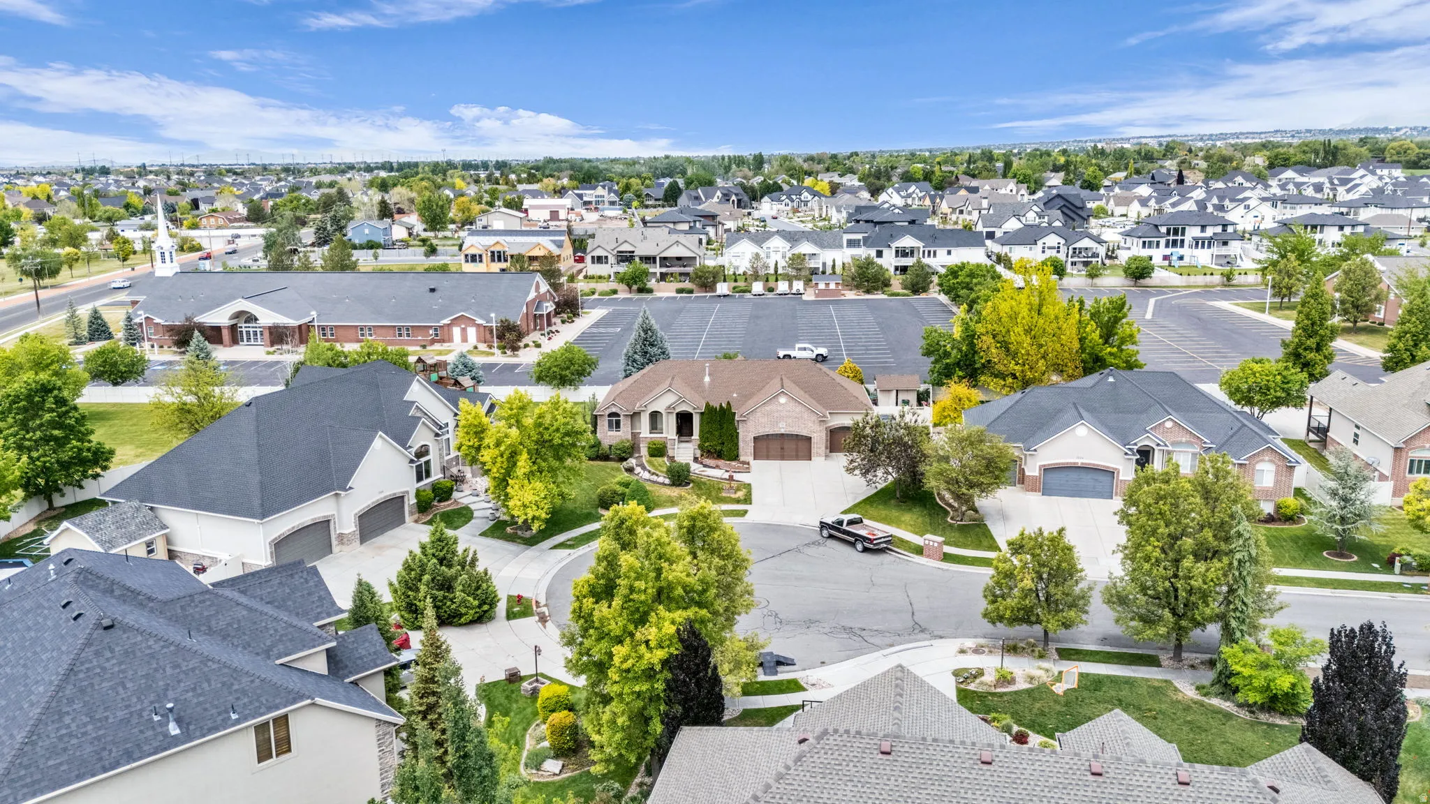 Residential neighborhood featuring mature trees and a curvilinear street plan