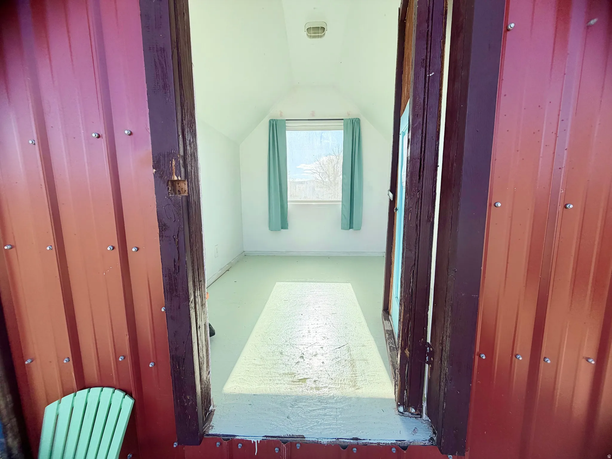 Room featuring light green flooring and white walls
