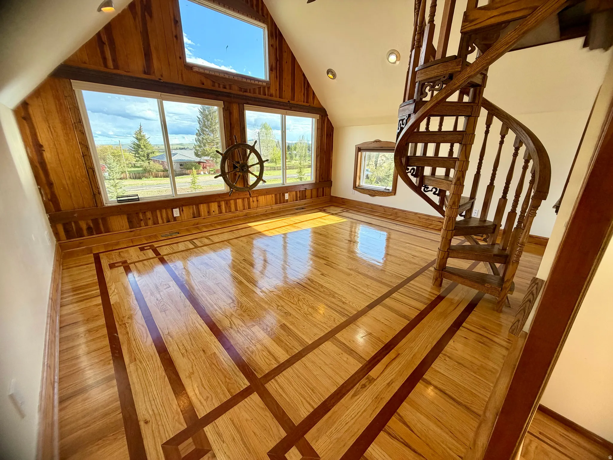 Richly patterned wood-finish flooring with dark wood inlay