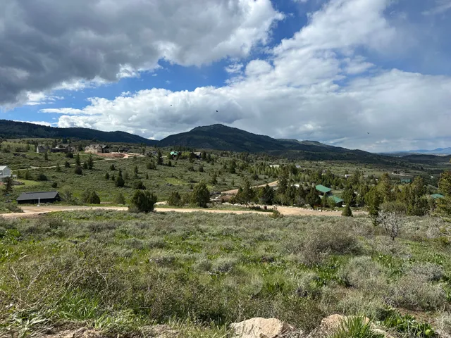 Expansive undeveloped acreage featuring natural terrain and distant mountain ranges