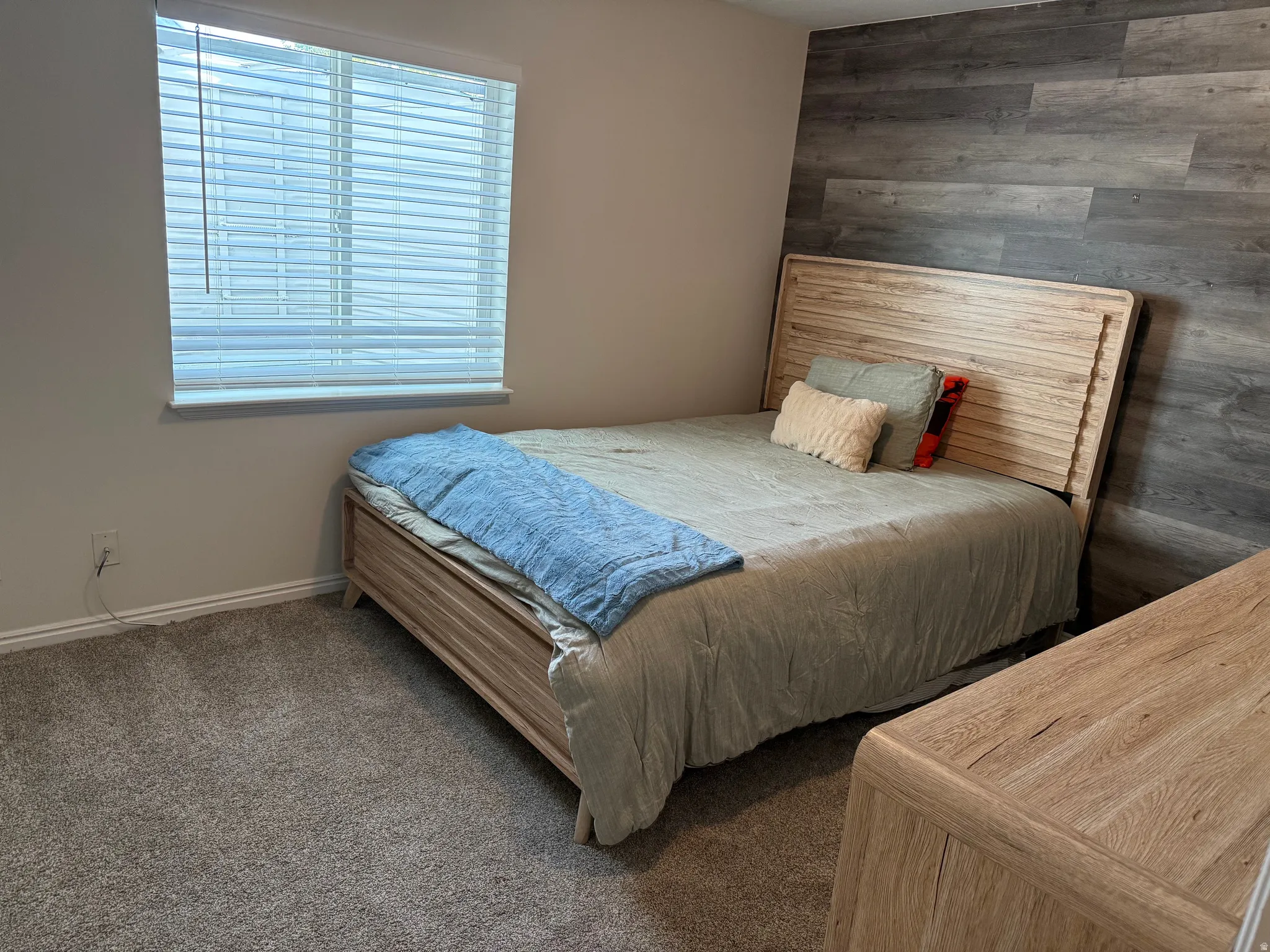 Textured accent wall and neutral wall paint
