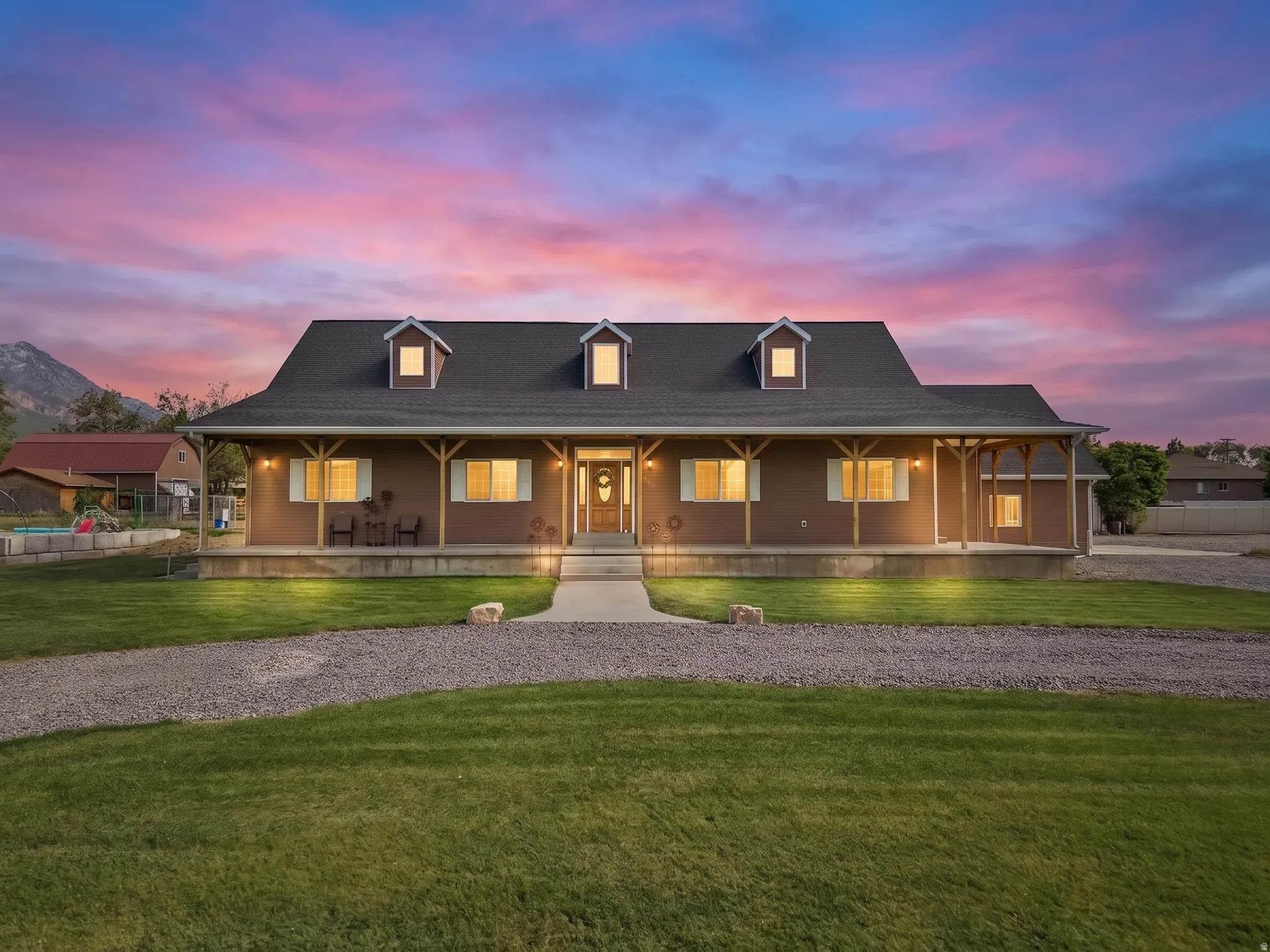 Single-story residence featuring a covered front porch with exposed wood beams