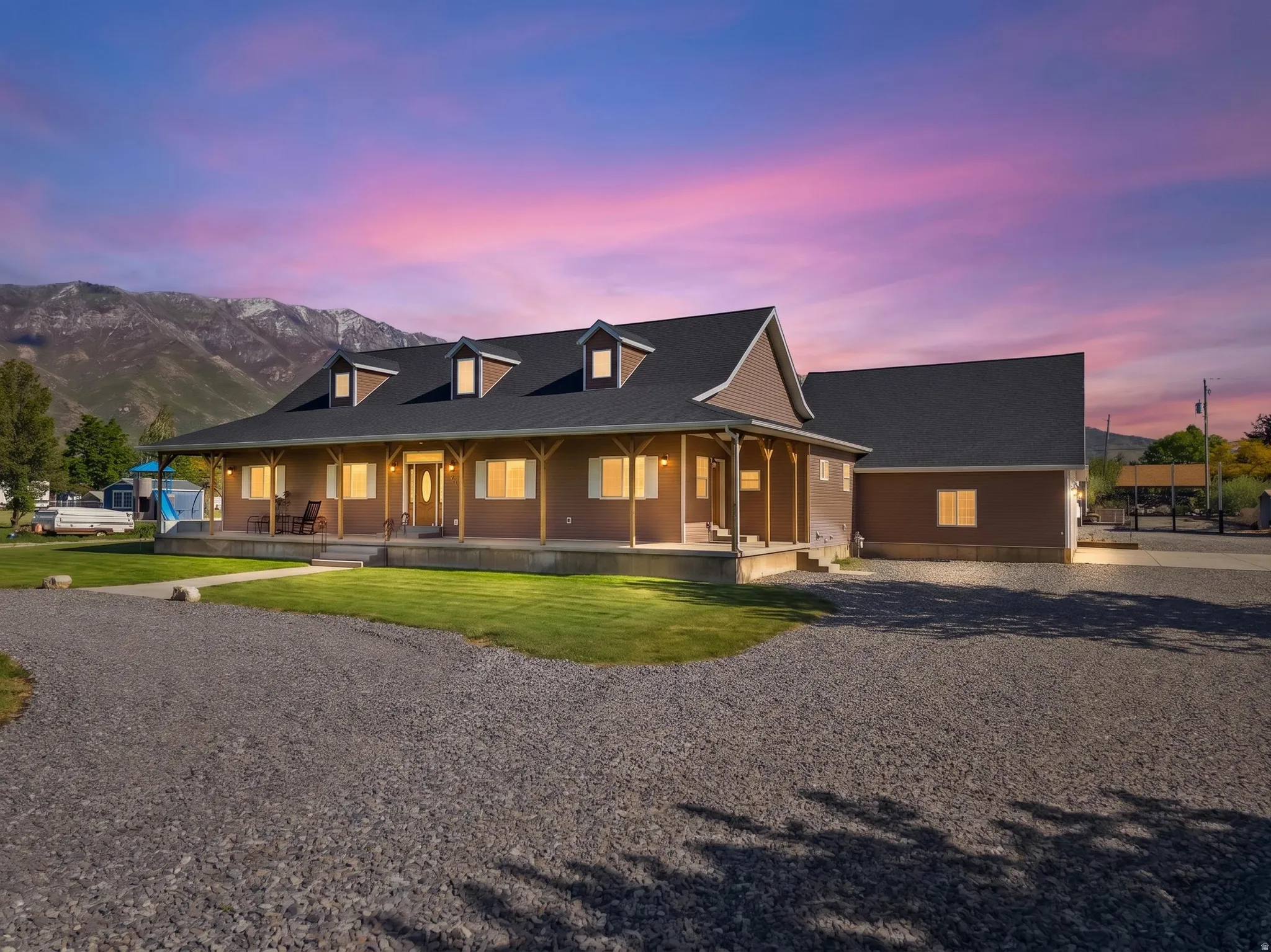Expansive gravel driveway providing ample parking