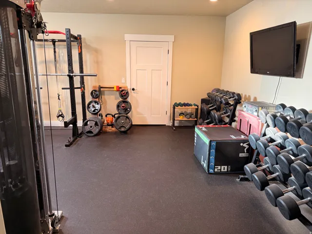 Dedicated exercise space featuring durable rubber flooring