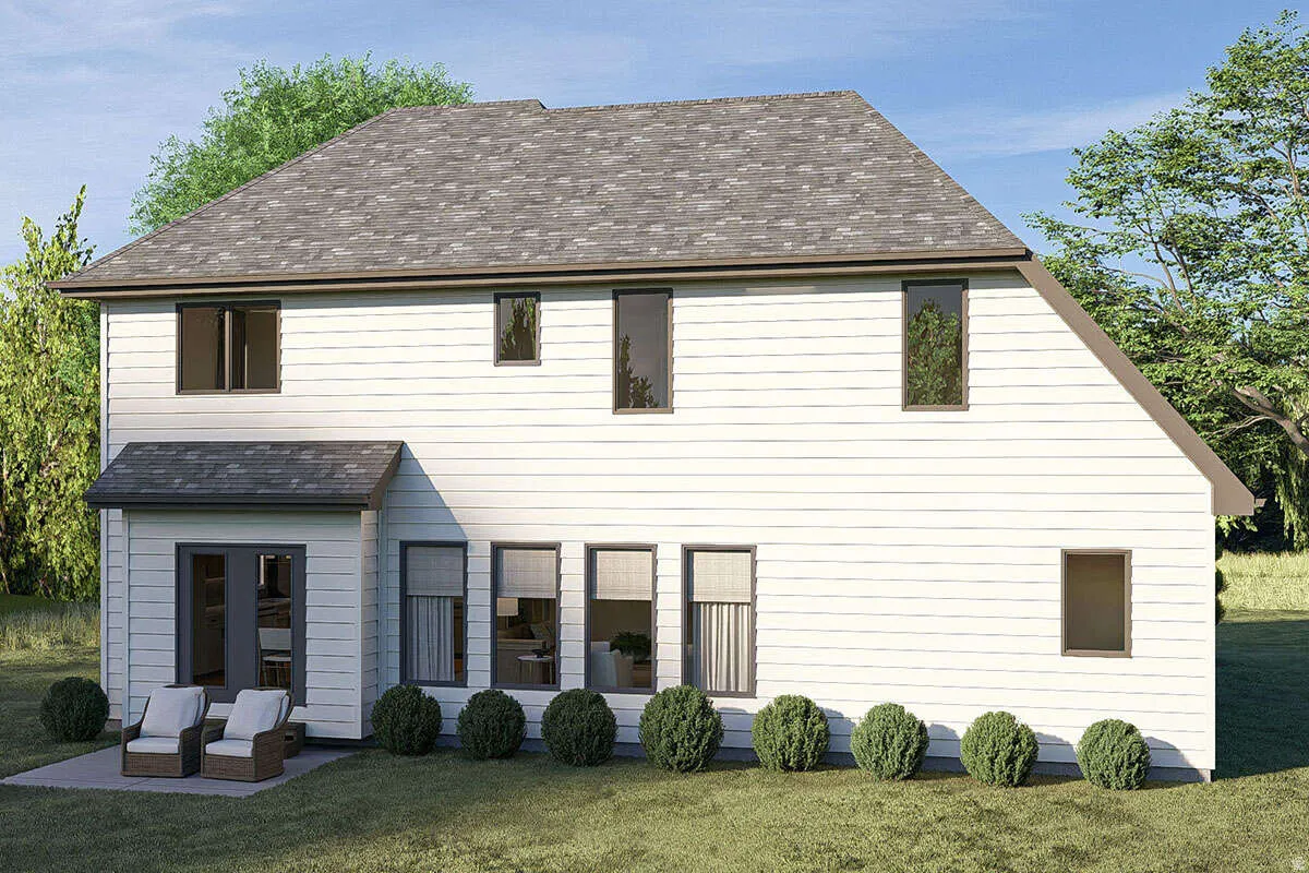 Rear exterior featuring white horizontal siding and a multi-level roofline