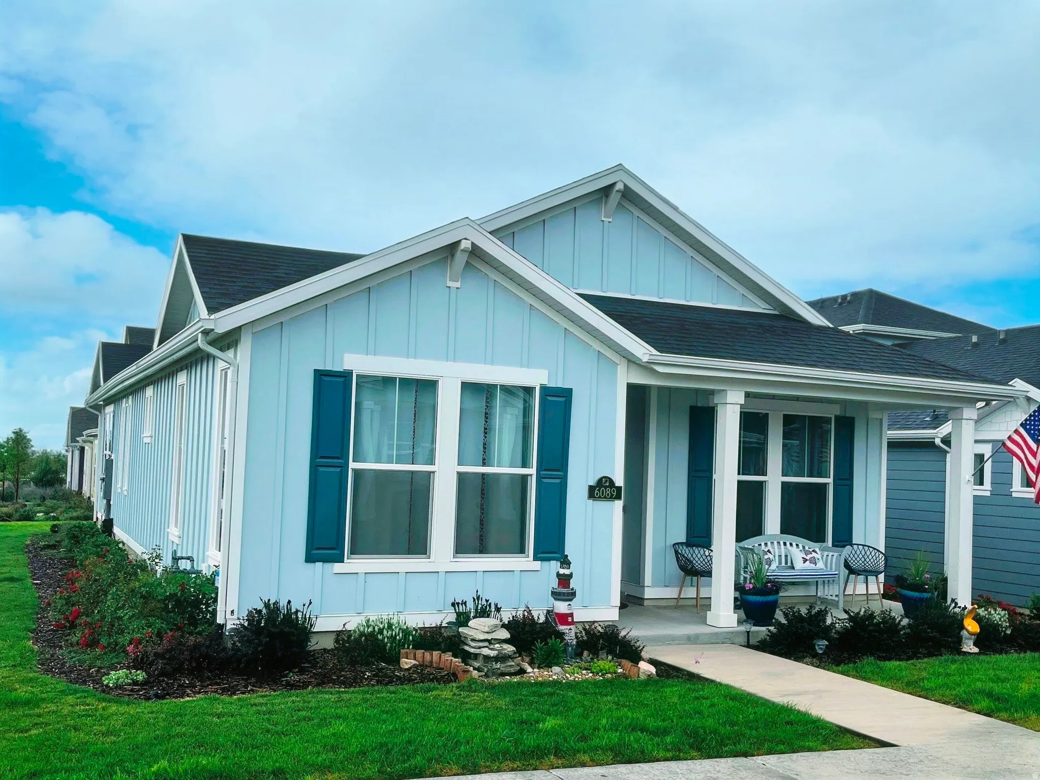 Light blue siding exterior with vertical board and batten accents