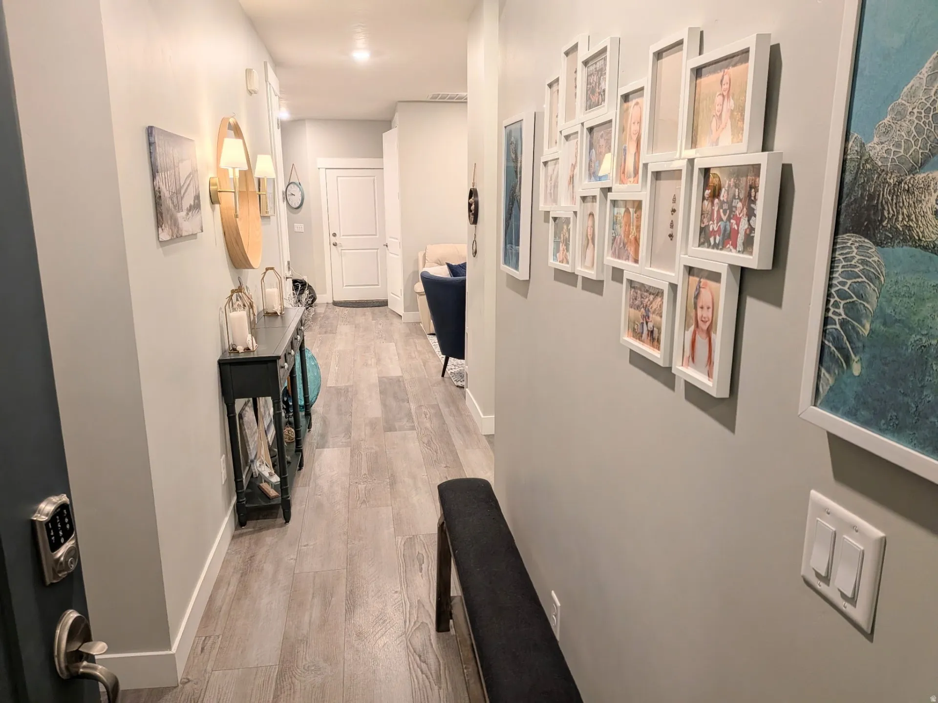 Entryway featuring wood-finish flooring, recessed lighting, and crisp white trim