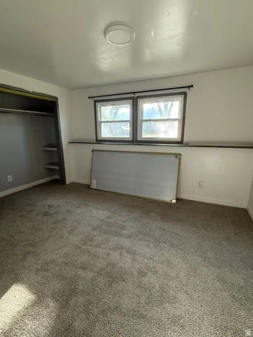 Wall-to-wall carpeting with built-in closet shelving
