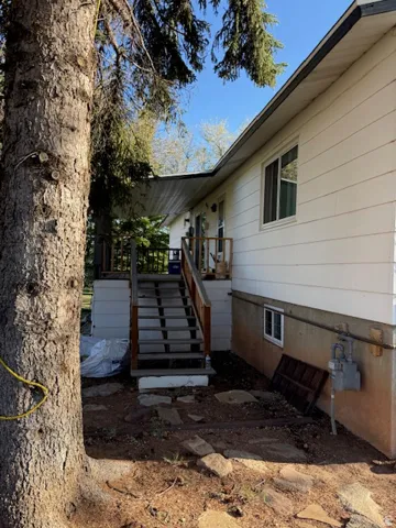 Exterior deck with wood railings and stairs