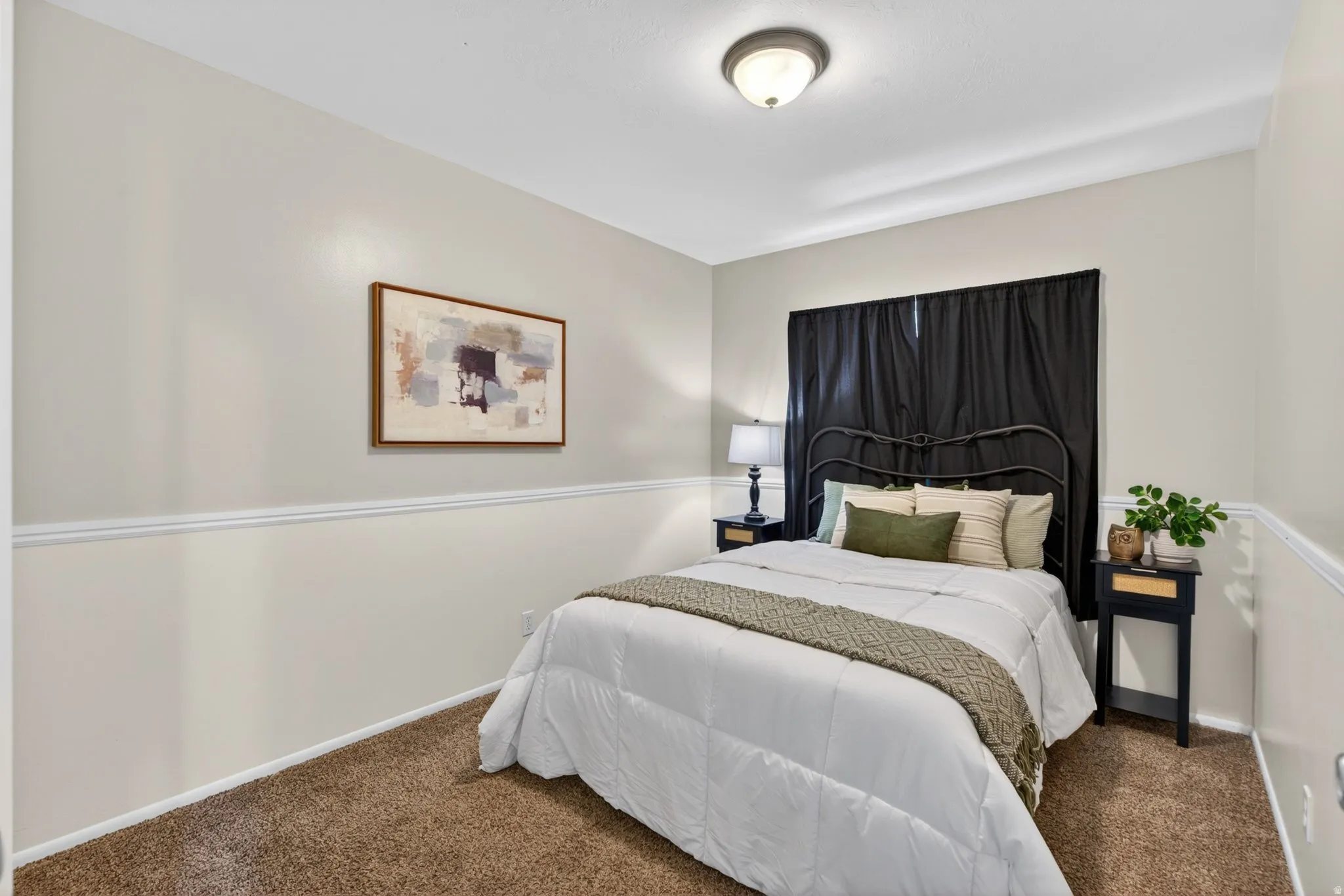 Bedroom featuring neutral tone walls, white trim, recessed lighting, and carpet flooring