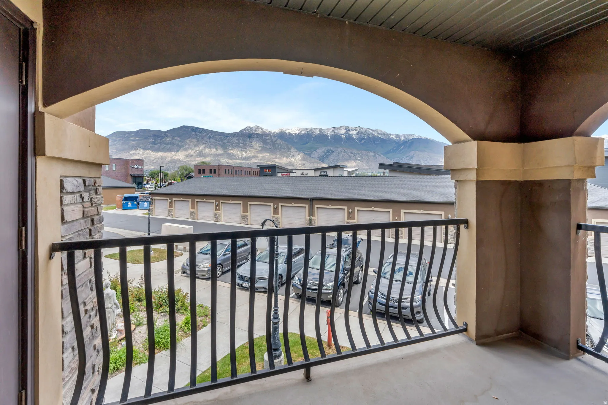 Balcony with arched architectural details and decorative metal railing
