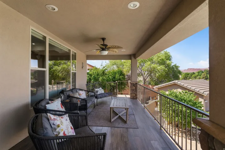 Covered outdoor patio featuring recessed lighting, a ceiling fan, and wood-finish flooring
