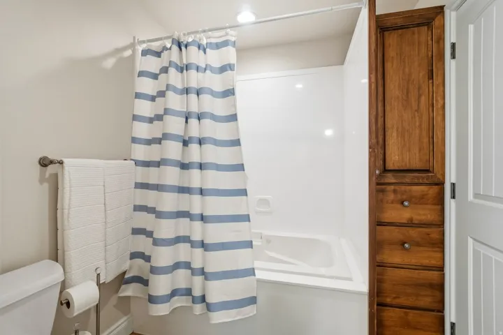 Built-in tub-shower combination with white surround