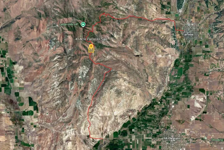 Satellite Map. Identifying the location of a 40-acre parcel relative to nearby geographical features and towns. Red lines show the county roads and access to the property.