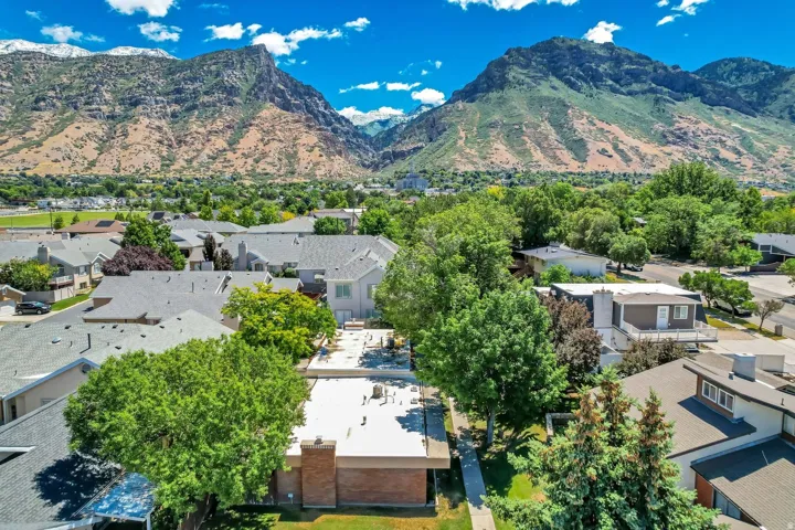 Expansive mountain backdrop with established residential properties