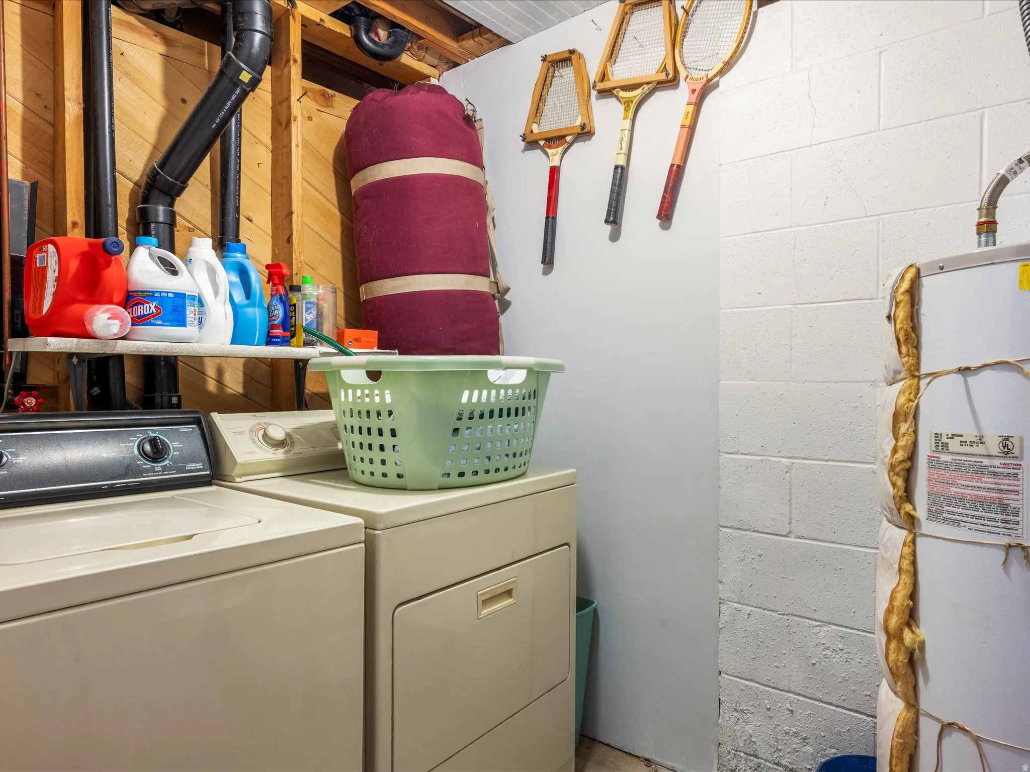 Dedicated laundry area featuring a washer and dryer unit