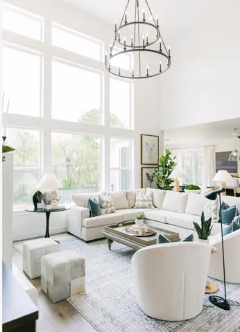 Expansive living area featuring a two-story ceiling and wood-finish flooring
