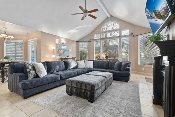 Vaulted ceiling with a ceiling fan and recessed lighting