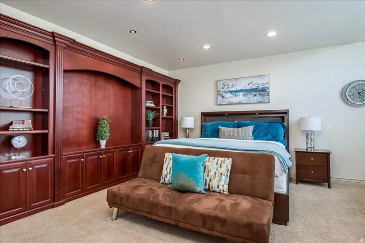 Built-in mahogany shelving and cabinetry spanning a full wall
