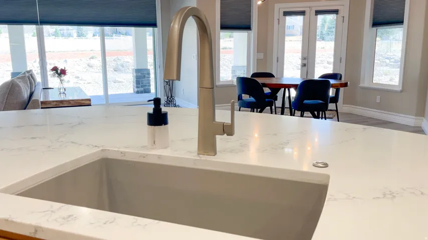 Kitchen island with a deep basin sink and a contemporary brushed nickel faucet